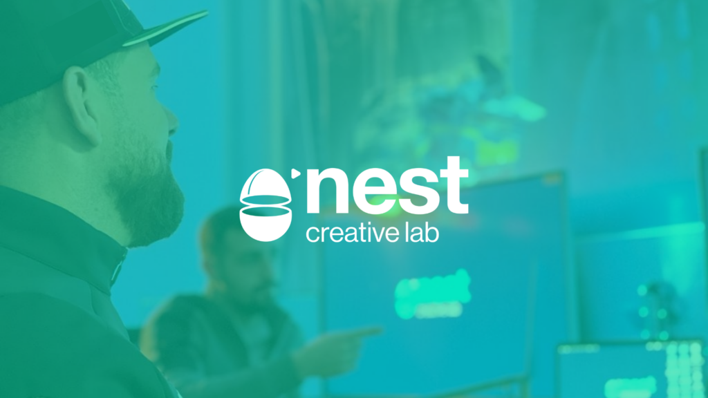 Nest creative logo against a blue-green background with two men looking at a screen