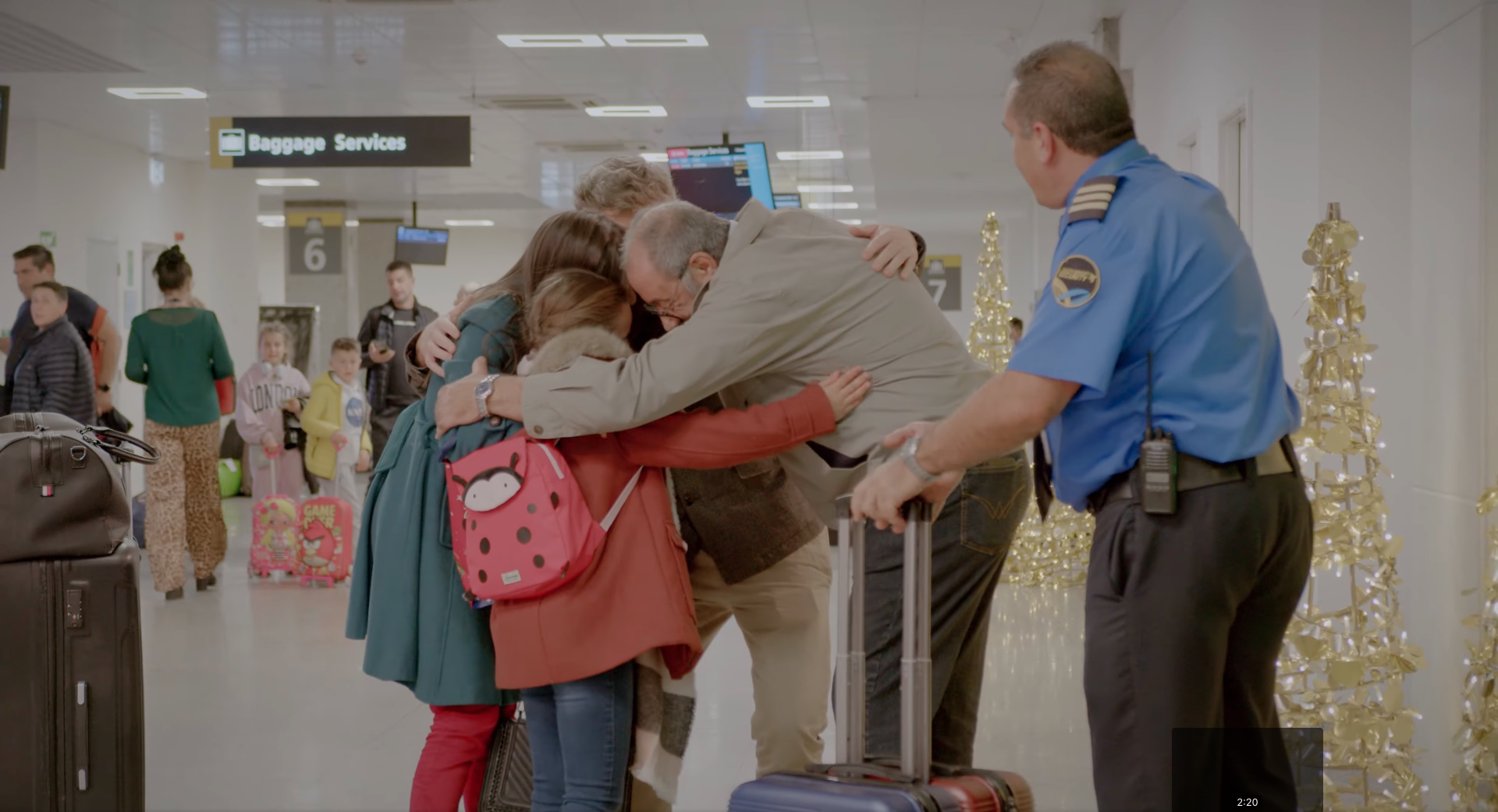 A Family is hugging each other at the airport