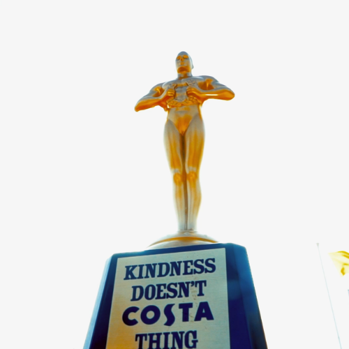 Trophy award with 'Kindness doesn't COSTA thing'