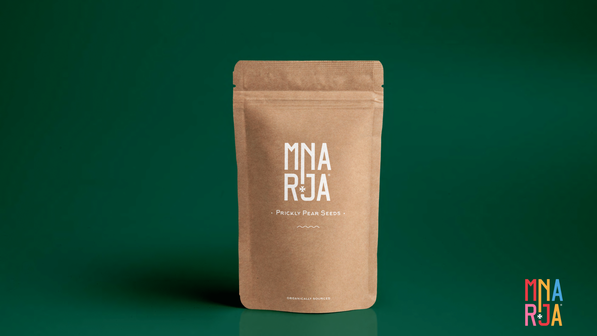 Merchandise, packaging brown paper bags with Mnarja Logo and text 'prickly pear seeds', 'organically sourced'